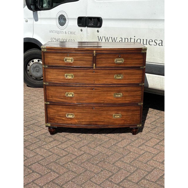 Victorian Campaign Chest Of Drawers. Brass Handles & Brass Bound, Bow Fronted. 93 cms high 50 cms depth 100 cms wide Has...