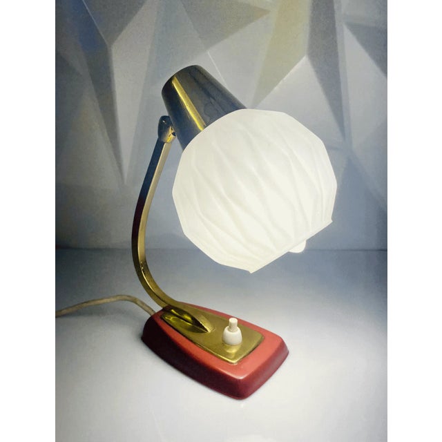 This exceptional German mid-century table lamp dates back to the 1950s and perfectly embodies classic German mid-century...
