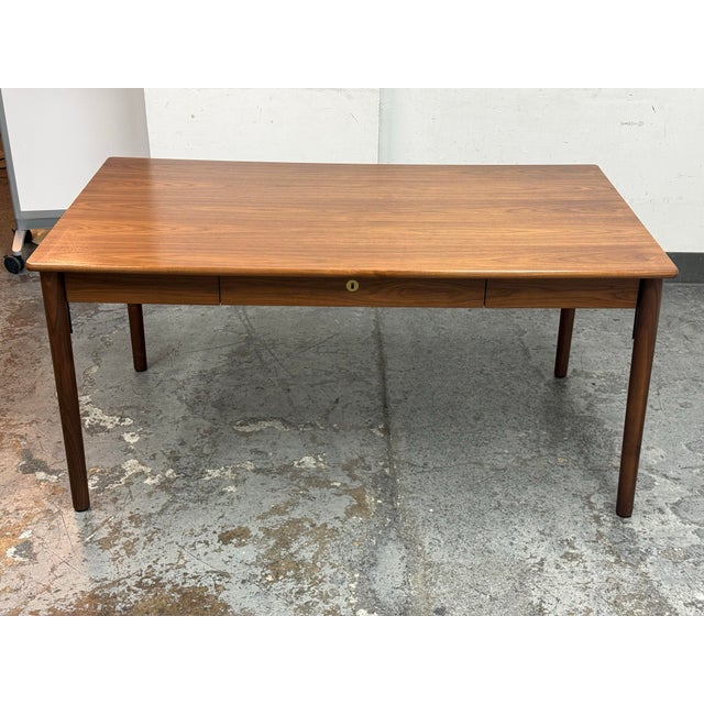 Design Plus Gallery presents a Edel Walnut Table by Thomas Jenkins & Sverre Uhnger for Design Within Reach. This walnut...