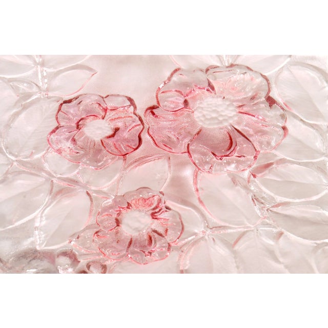 A frosted glass cake plate in the Rosella pattern made by Mikasa of New Jersey. Etched with pink colored roses surrounded...