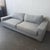 This Ben Soleimani 3-seat sofa offers a clean, modern look with its light gray fabric and square arm design. The cushions...