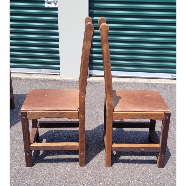 Fabulous set of 10 vintage Spanish mission dining chairs. Each chair features leather seats and wood frames. I'm not sure...