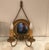 A pair of giltwood and gilt metal wall sconces with mirrored backs. The round framed backs with mirrors with rope style...