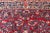 Antique Sarouk Long Gallery Runner With All-Over Flower Design in Red Background For Sale - Image 10 of 12