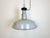This industrial lamp was made in former Czechoslovakia during the 1950s. It features grey enamel shade with white...