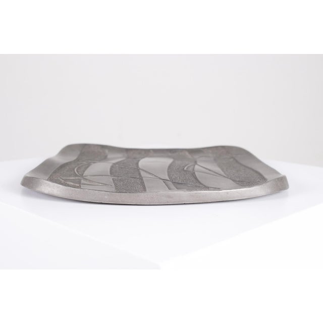 Pewter trinket dish, marked h & w for eva herbiet and freddy wybaux l 22 cm x d 22 cm x h 1 cm. Perfect condition.