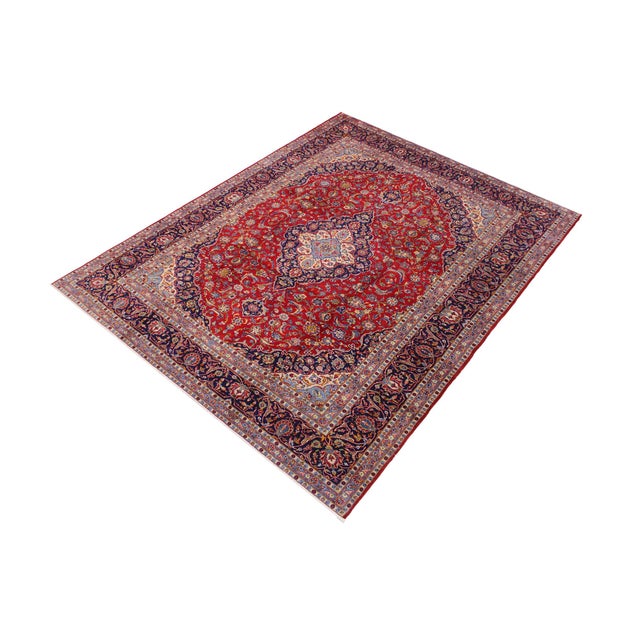 Enhance your space with this beautiful hand-knotted wool rug measuring approximately 9.8 x 12.11 feet. This large carpet...