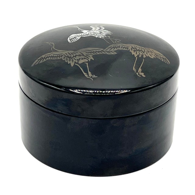 9 wood base plates with black lacquer coating. Very lightweight. The crane imagery, lacquer technique, and form are all...