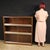 Italian design bookcase from the 1960s/70s. Walnut display cabinet with glass doors that slide on metal tracks. Excellent...
