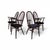 This set of four Windsor chairs, featuring a more modern design, is in good condition. The mahogany wood of the chairs...