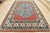 This traditional tribal geometric Caucasian Kazak rug is hand-knotted with an all-wool pile on a cotton foundation. This...