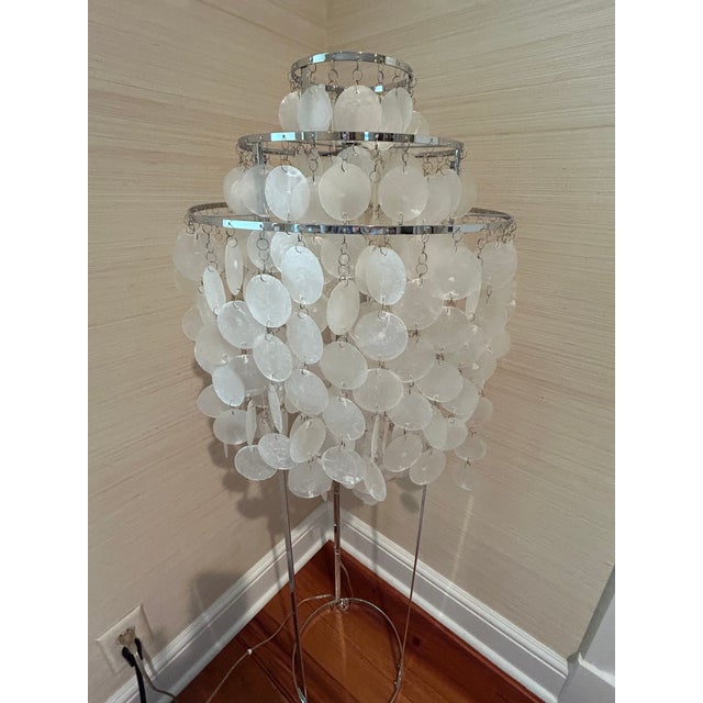 A glam floor lamp in the style of Danish designer Verner Panton having multiple tiers of cascading hand cut mother of...