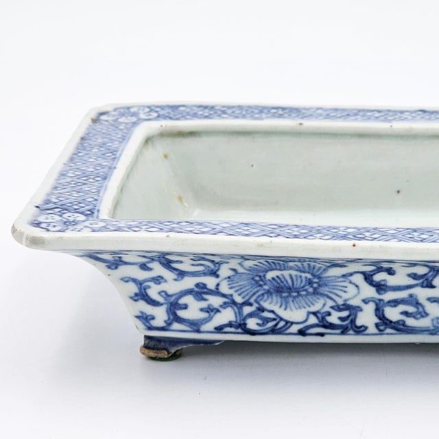 A Japanese blue and white ikebana container, circa 1920.