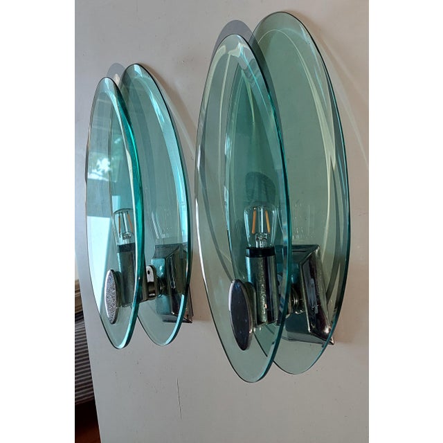 This pair of Fontana Arte Wall lights are in an excellent condition , made in Italy using 2 heavy glass plates of...