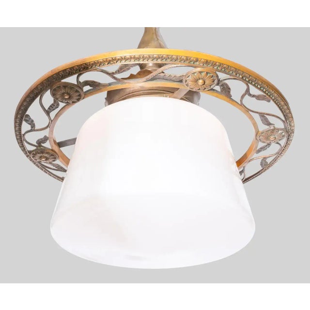 Antique Arts and Crafts schoolhouse bronze fixture with an original milk glass shade. Heavy chain and canopy. In very good...