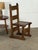 Set of six Dutch Brutalist dining chairs in solid oak from the mid-20th century. Their tall ladder backs, broad plank...