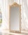 Grotto Style Shell Mirror composed off all natural shells set by hand. Tiered rows of scallops, murex, turbo shells, and...
