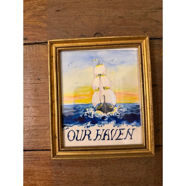 Charming vintage nautical artwork depicting a full-sailed ship cutting through deep blue waves beneath a softly colored...
