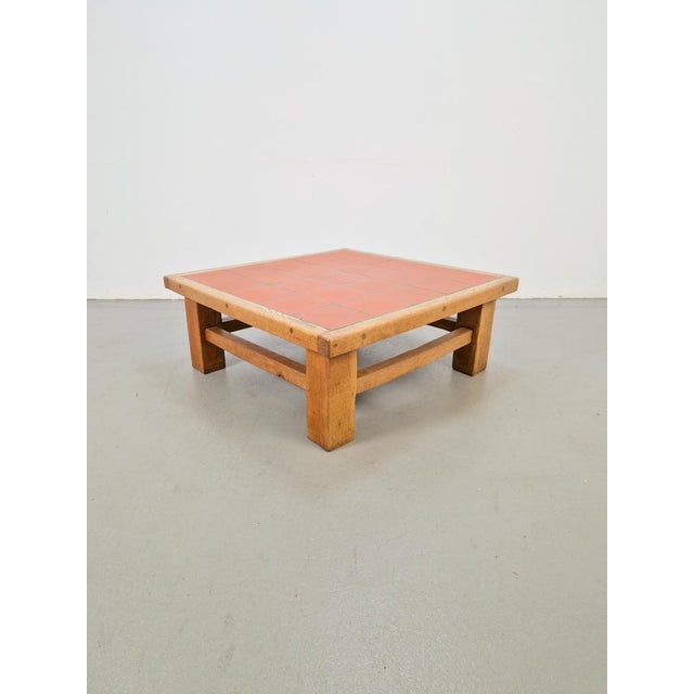 Brutalist oak coffee table with terracotta tiles, 1950s Solid Brutalist oak coffee table with terracotta tiles, 1950s The...