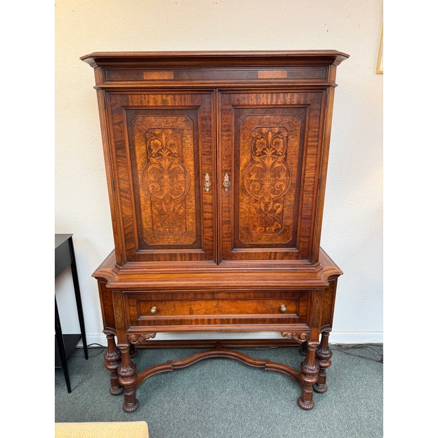 Design Plus Gallery presents an Antique Marquetry Hutch from Orinoco Furniture Company. This is a collectible early 20th-...