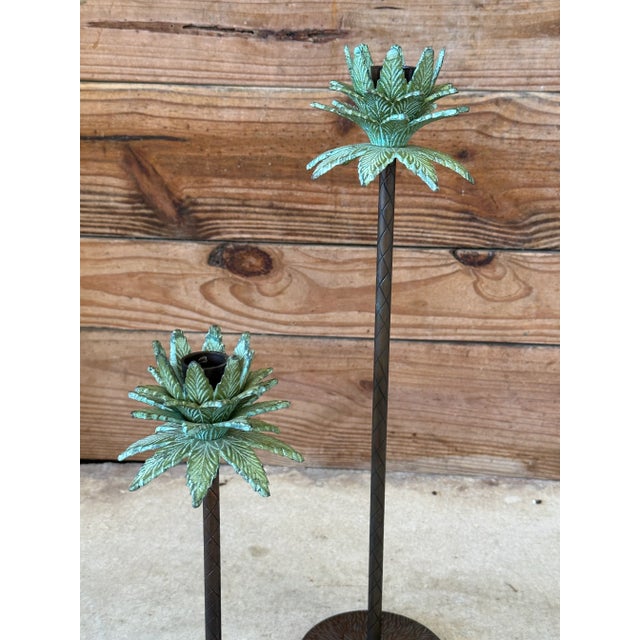 Fabulous pair of decorative metal palm tree candle holders featuring beautifully detailed tropical foliage with a...