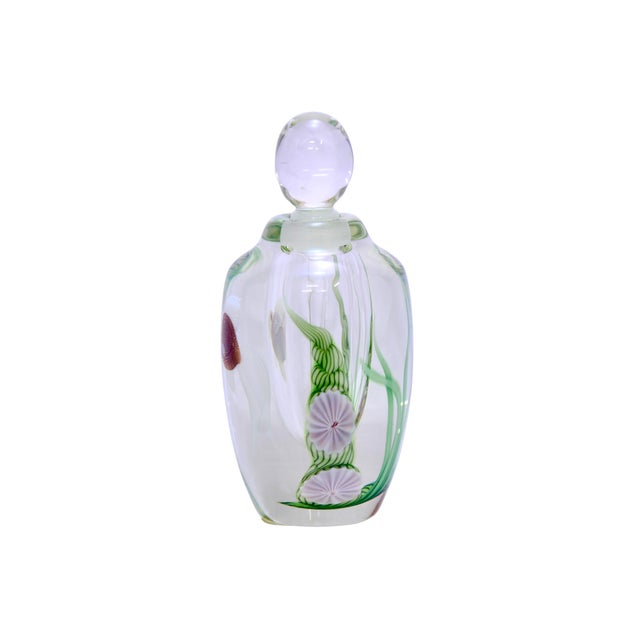Large five inch vintage hand blown art glass perfume bottle featuring a white beta fish surrounded by celadon green plants...