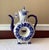 A sculptural delight in cobalt and cream, this vintage Russian Gzhel porcelain teapot transforms traditional function into...