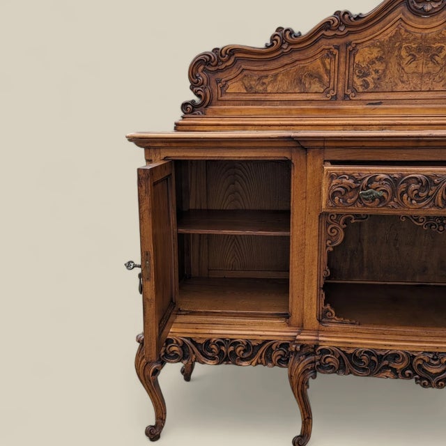 Bring timeless design into your home with this antique Italian sideboard in carved and burl wood. Design Highlights: A...