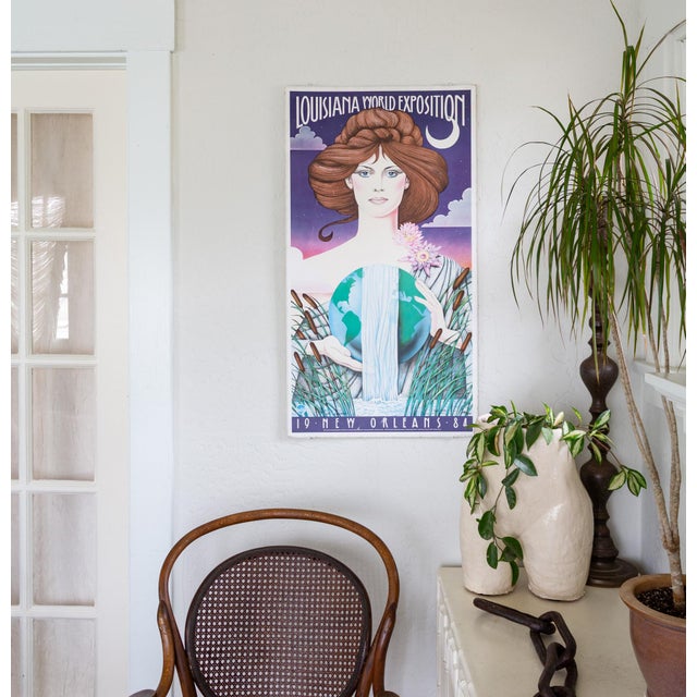 A signed and numbered Hugh Ricks 1984 Louisiana World Exposition matte poster on pressboard, commemorating the New Orleans...