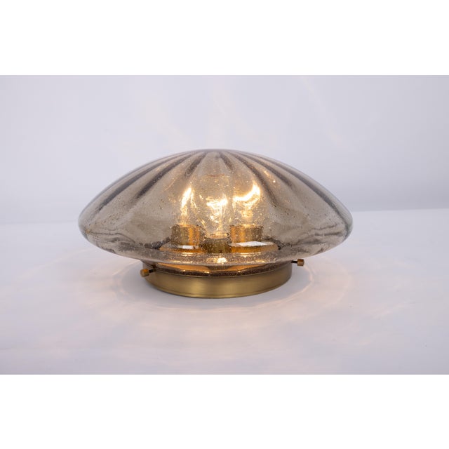 A wonderful round smoked glass flush mount light by hillebrand leuchten, germany, 1970s. Thick textured glass on a brass...