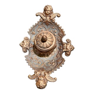 Antique Bronze and Brass Inkwell, With Cupids and Other Raised Relief Renderings of Floral, Acanthus Leaf Motifs and Green Tree Heads For Sale