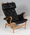 Bruno Mathsson Pernilla lounge chair with patinated leather. Frame in beech. Made by DUX. 25 years annivesary model This...