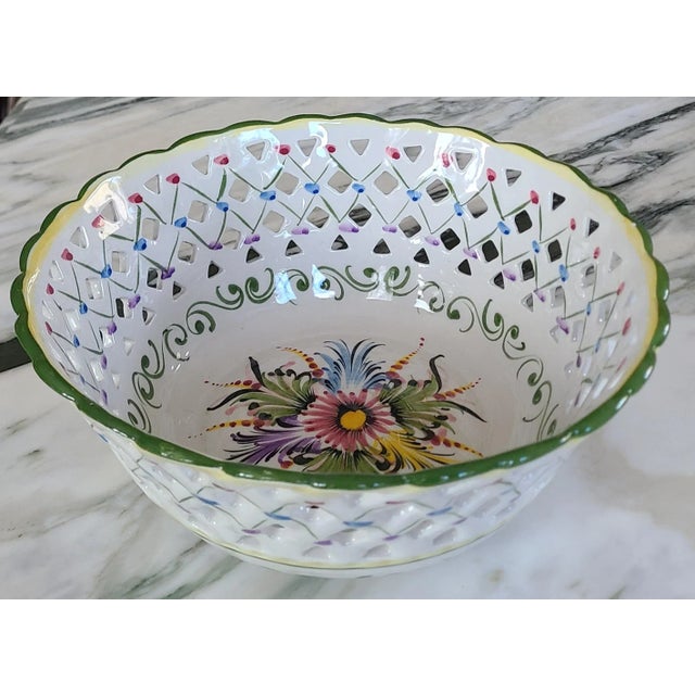Presenting a large hand-painted fruit bowl made in Portugal in the 1980's. This is a painted and glazed ceramic piece with...