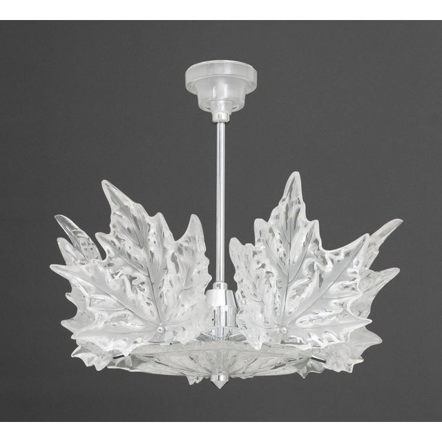Lalique Champs-Elysees Chandelier, six-lights with molded clear and frosted leaf motif on chrome-plated hexagonal frame,...