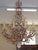 Schonbek Genisis 9882 Rock & Color Crystal 15 Light Chandelier Dimensions : 38" Tall X 29" Wide X 29" Deep The Schonbek...