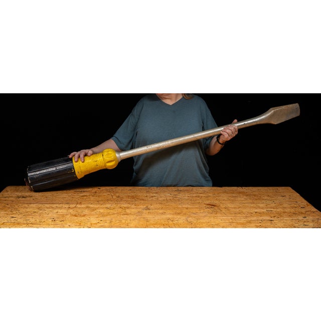 Monumental oversized advertising display modeled after a flathead screwdriver, likely produced as a point-of-sale or trade...