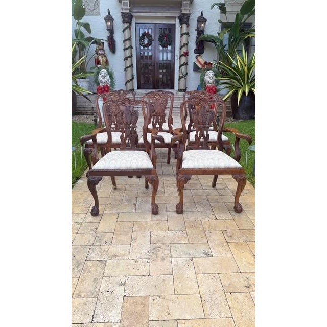 Commanding, sculptural, and richly detailed — this set of 8 hand-carved Phoenix-back dining chairs makes a dramatic...