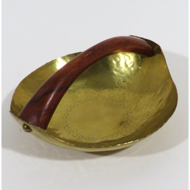 Vintage Hein Matten hammered brass and teak wood bowl. The brass bowl has a circular decoration and handle is polished...