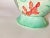 It is a ceramic vase, which has been painted by hand. It is signed by the artist, and dated circa 1970. This vase was made...