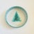 A large vintage art pottery bowl by Pysht Pot. Green and pale gray glazes featuring the image of an evergreen tree in the...