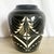 This striking 1989 sgraffito pottery vase by the Curras Brothers exemplifies bold graphic artistry and refined handcraft....