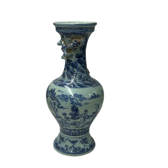 This vintage Chinese blue and white porcelain vase, featuring intricately hand-painted figural landscape scenes, raging...