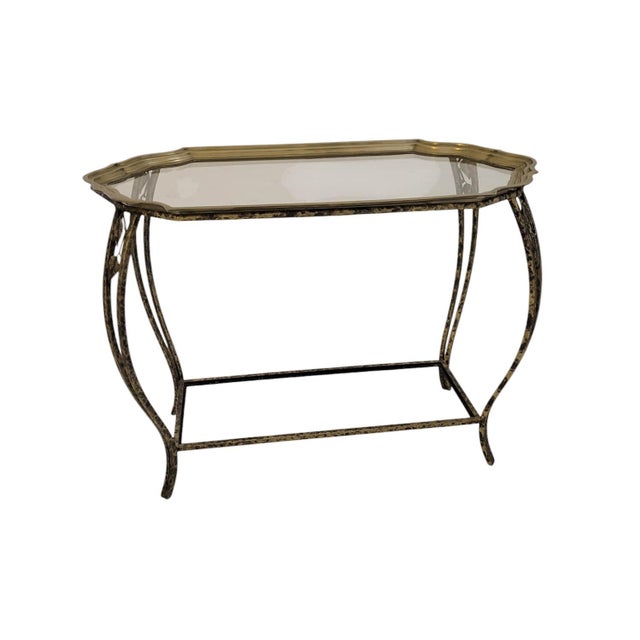 This accent table blends organic and refined elements. Its wrought iron base, finished with a black and gold antiquing...