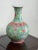 This antique Qing Dynasty famille rose porcelain vase represents the elegance and artistry of Chinese decorative...