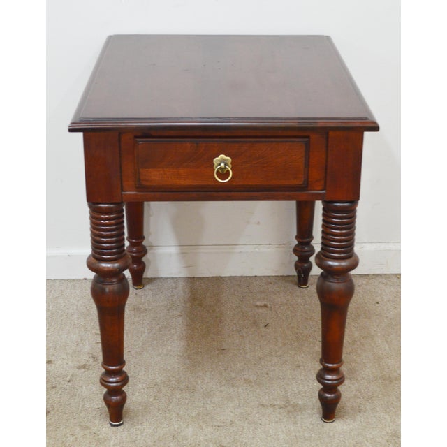 Cherry Nightstand by Ethan Allen. Store item #565.It features turned legs and one drawer.