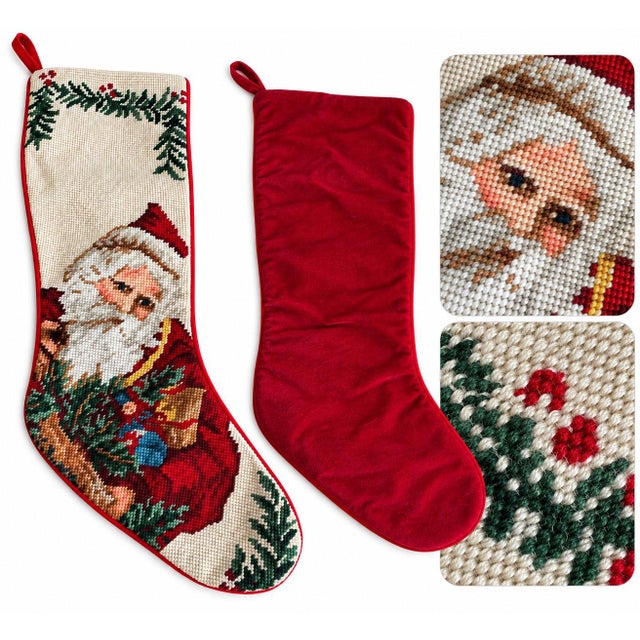 Beautiful Christmas stocking featuring a detailed needlepoint Santa Claus design with festive greenery and colorful...