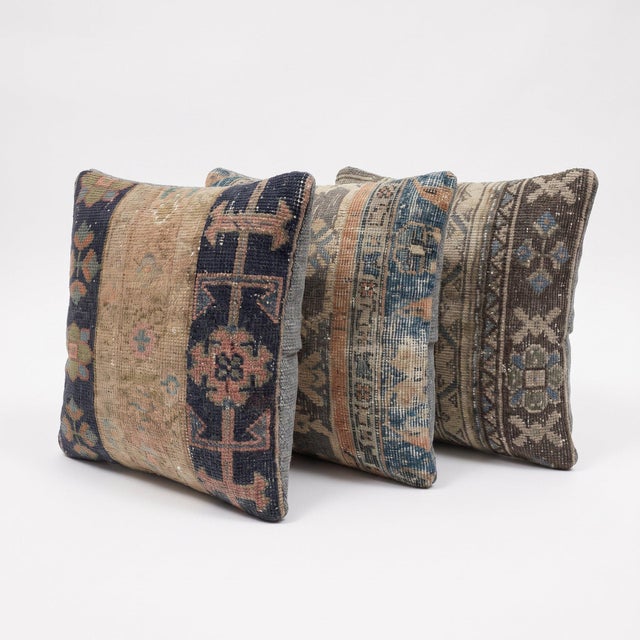 This 20'' x 20'' pillow cover set was made from authentic Turkish rug pieces — tribal striped bands in indigo blue and...