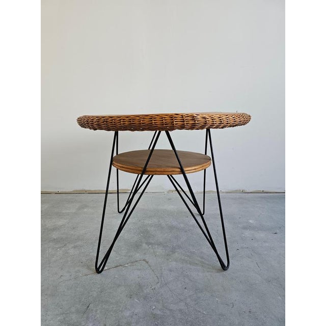 In this listing you will find a gorgeous Mid Century Modern Patio Table. It features wicker and wood top attached to black...