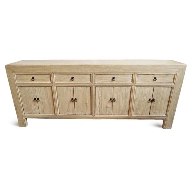 Solid raw elm wood sideboard with four drawers on top and eight doors below that open to spacious storage area with...
