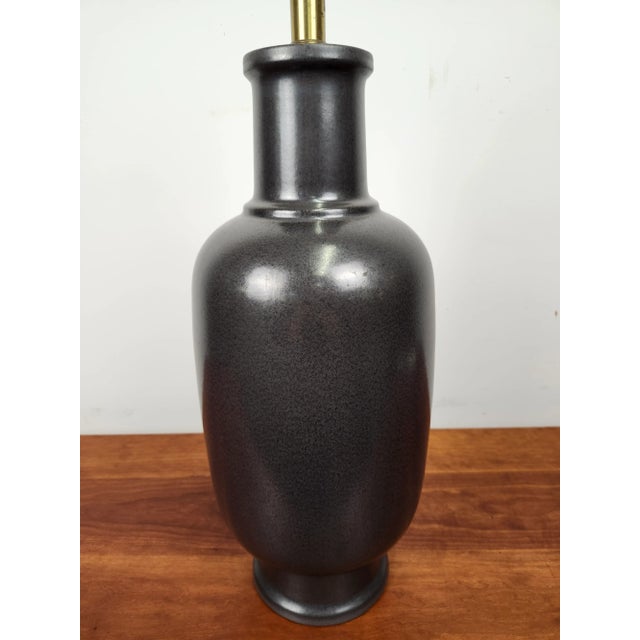 Beautifully bold Lee Rosen for Design Technics pottery lamp. Gunmetal grey in color, this lamp has a great 1960s form.
